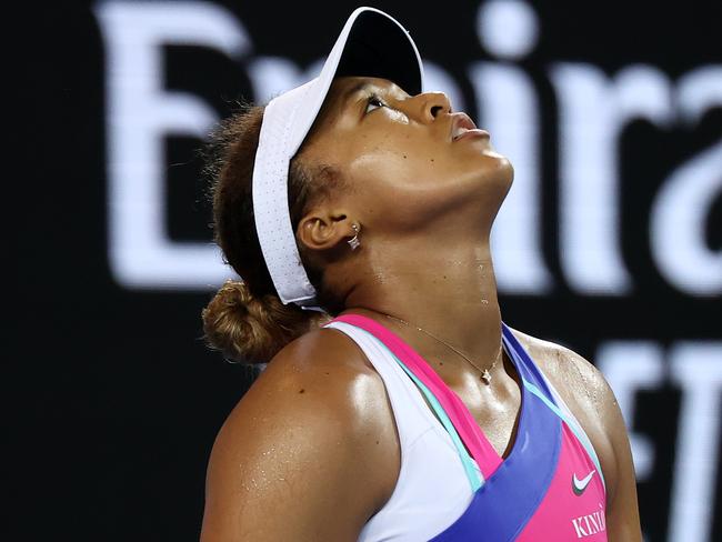 MELBOURNE, AUSTRALIA - JANUARY 21: Naomi Osaka of Japan reacts after losing a point in her third round singles match against Amanda Anisimova of United States during day five of the 2022 Australian Open at Melbourne Park on January 21, 2022 in Melbourne, Australia. (Photo by Mark Metcalfe/Getty Images)