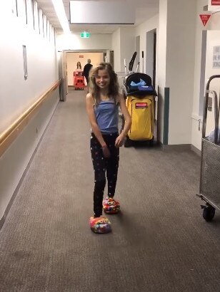 Milli Lucas strolls the hospital hall this week. Picture: Facebook/TeamMillstar