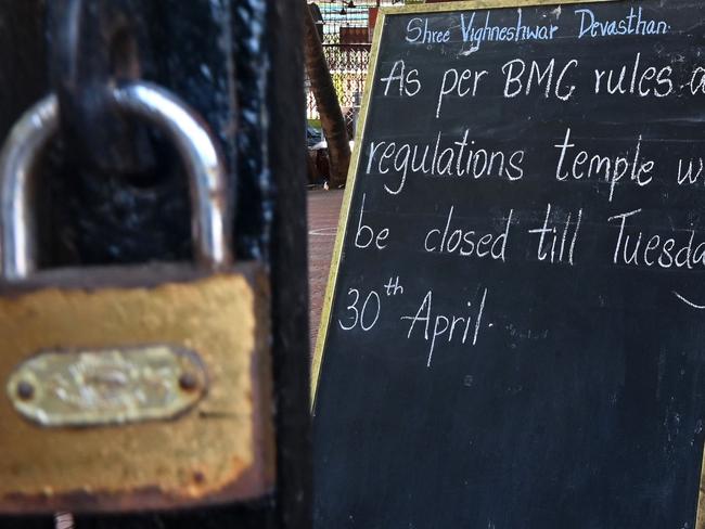 A notice advises of the closure of a temple of the Hindu God of prosperity, Lord Ganesha, in Mumbai. Picture: AFP