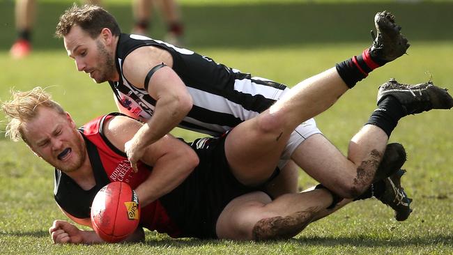 Liam Berry is tackled by Steven Boyall. Picture: Hamish Blair