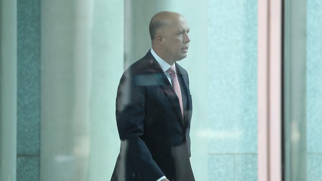 Peter Dutton walking to the partyroom meeting. Picture: Kym Smith.