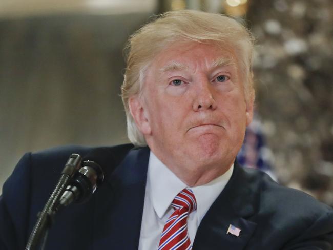 President Donald Trump pauses as he answers questions from members of the media in the lobby of Trump Tower in New York. Picture: AP Photo/Pablo Martinez Monsivais