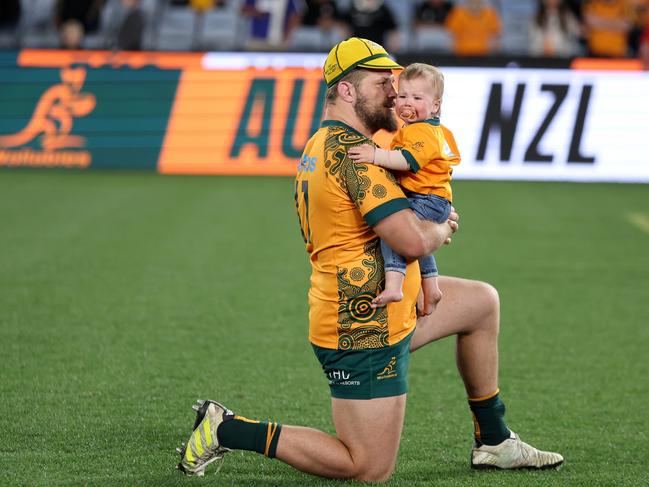 SYDNEY, AUSTRALIA - SEPTEMBER 21: James Slipper of the Wallabies shares a moment with his son after The Rugby Championship &amp; Bledisloe Cup match between Australia Wallabies and New Zealand All Blacks at Accor Stadium on September 21, 2024 in Sydney, Australia. (Photo by Matt King/Getty Images)