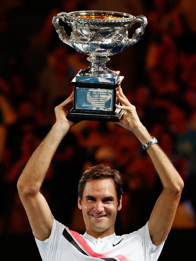 And Roger Federer taking home the men’s trophy earlier this year. (Pic: Scott Barbour/Getty)