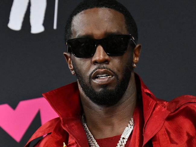 (FILES) (FILES) US producer-musician Sean "Diddy" Combs poses with the Global Icon award in the press room during the MTV Video Music Awards at the Prudential Center in Newark, New Jersey, on September 12, 2023. Music mogul Sean Combs is set to go on trial for racketeering and sex trafficking on May 5, 2025, a judge said in a court hearing October 10, 2024. The rapper known as "Diddy" will remain incarcerated, said federal judge Arun Subramanian, after he was indicted last month on three criminal counts that allege he sexually abused women and coerced them into drug-fueled sex parties using threats and violence. (Photo by ANGELA WEISS / AFP)