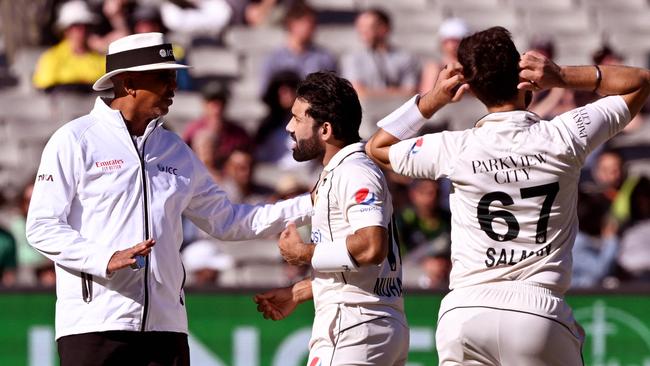 Mohammad Rizwan (C) argues his case with umpire Joel Wilson (L). Picture: William WEST