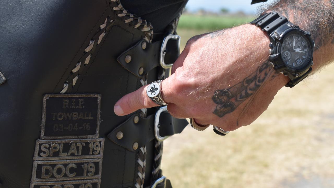 Sons of the Southern Cross Mackay member James "Knuckle" McGovern proudly but sadly rides with the names of fallen riders on his leathers. Picture: Heidi Petith