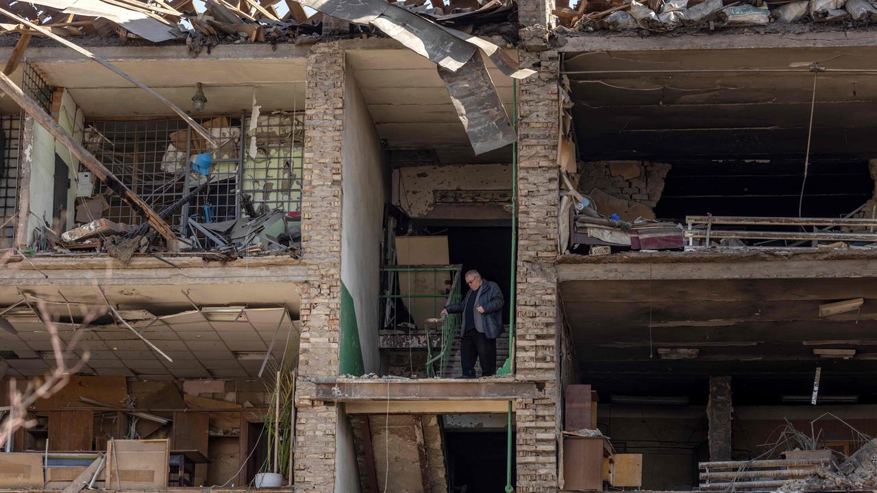 A man stands in a building with a collapsed facade at the Vizar company military-industrial complex. Picture: FADEL SENNA / AFP