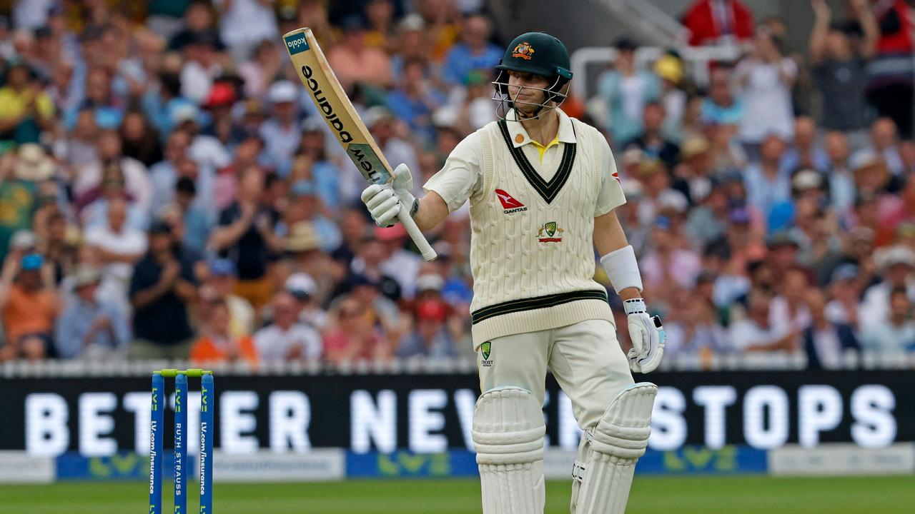 Australia's Steven Smith celebrates his half-century on day one. Picture: AFP