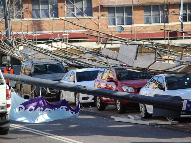 Scaffolding accident on Mann St in Gosford has seen eight cars and one ute crushed.  Picture: Fiona Killman