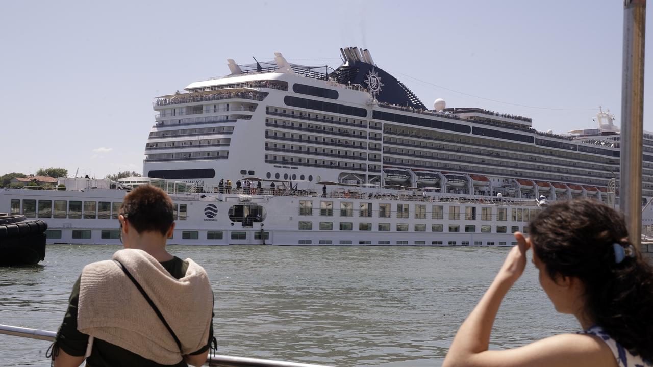 A tourist river boat was struck by a towering cruise liner that lost power as it entered a port in Venice. Picture: AP Photo/Luca Bruno.