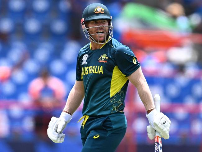 Australia's David Warner reacts after getting dismissed during the ICC men's Twenty20 World Cup 2024 Super Eight cricket match between Australia and India at Daren Sammy National Cricket Stadium in Gros Islet, Saint Lucia on June 24, 2024. (Photo by Chandan Khanna / AFP)