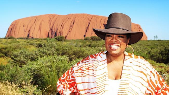 Oprah Winfrey at the sunset viewing area of Uluru during her Australia visit.