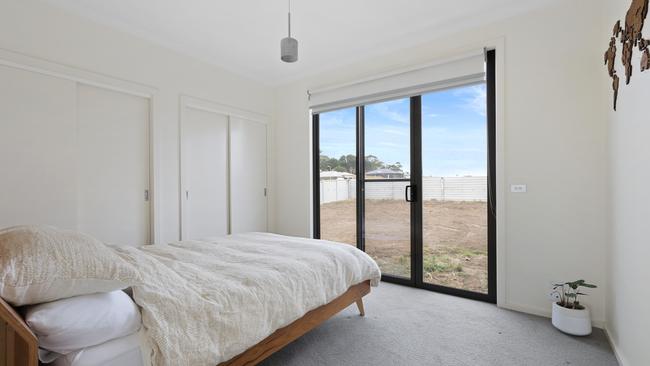 There’s two built-in wardrobes and direct access to the backyard, via a sliding door, in the bedroom.