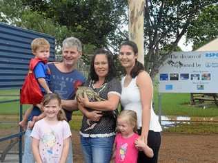 COMING HOME TO ROOST: Ian Birchley, Regina Birchley, Courtney Burrows, Laylah Dyer, Brydee Pszkit, and Axle Dyer at Kingaroy RSPCA with their new rooster Hei Hei. Picture: Madeline Grace