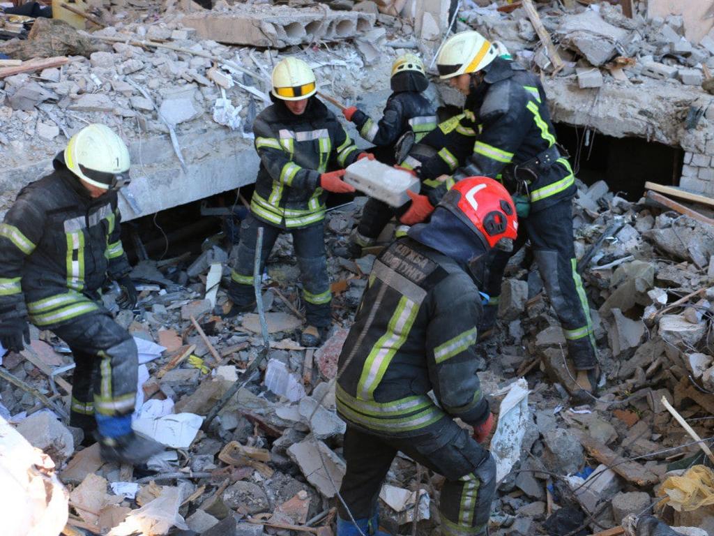 Ukrainian State Emergency Service rescuers conducting search operations and dismantling debris in Kharkiv. Picture: AFP