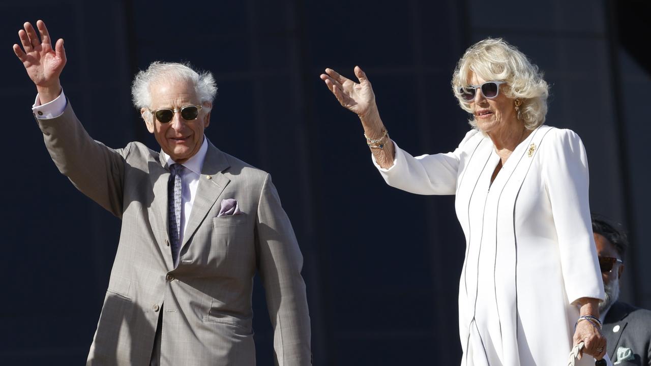 King Charles III and Queen Camilla pictured waving to the crowd at the Sydney Opera House. Picture: NewsWire / Damian Shaw