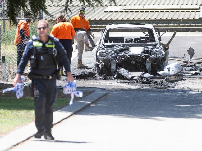 The Porsche believed to have been used in the shooting was found torched in Reservoir shortly after 10.30am near the intersection of Northernhay and Alexandra Streets. Picture: Tony Gough