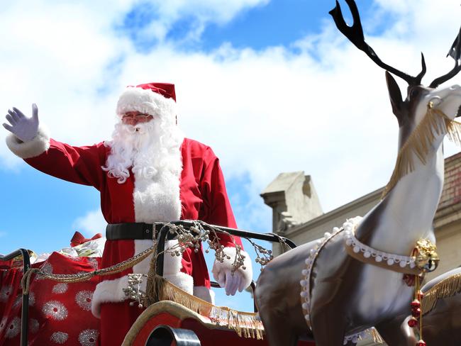 Santa waves to his fans. Picture: NIKKI DAVIS-JONES