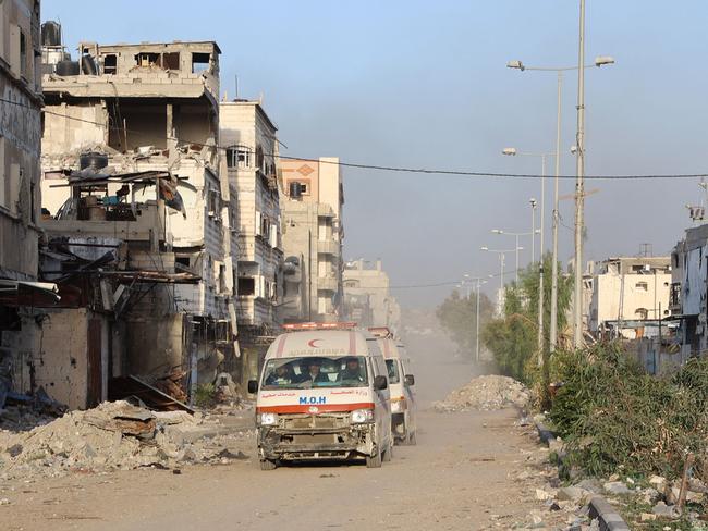 Ambulances transport wounded Palestinians from the Kamal Adwan Hospital to the al-Shifa hospital in Gaza City, on December 28. Picture: AFP