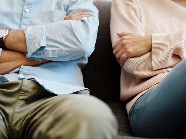 Cropped shot of a couple having a disagreement at home