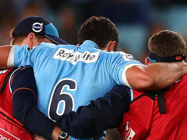 SYDNEY, AUSTRALIA - JUNE 28: Dave Dennis of the Waratahs is taken from the field with an injury during the round 17 Super Rugby match between the Waratahs and the Brumbies at ANZ Stadium on June 28, 2014 in Sydney, Australia. (Photo by Mark Nolan/Getty Images)