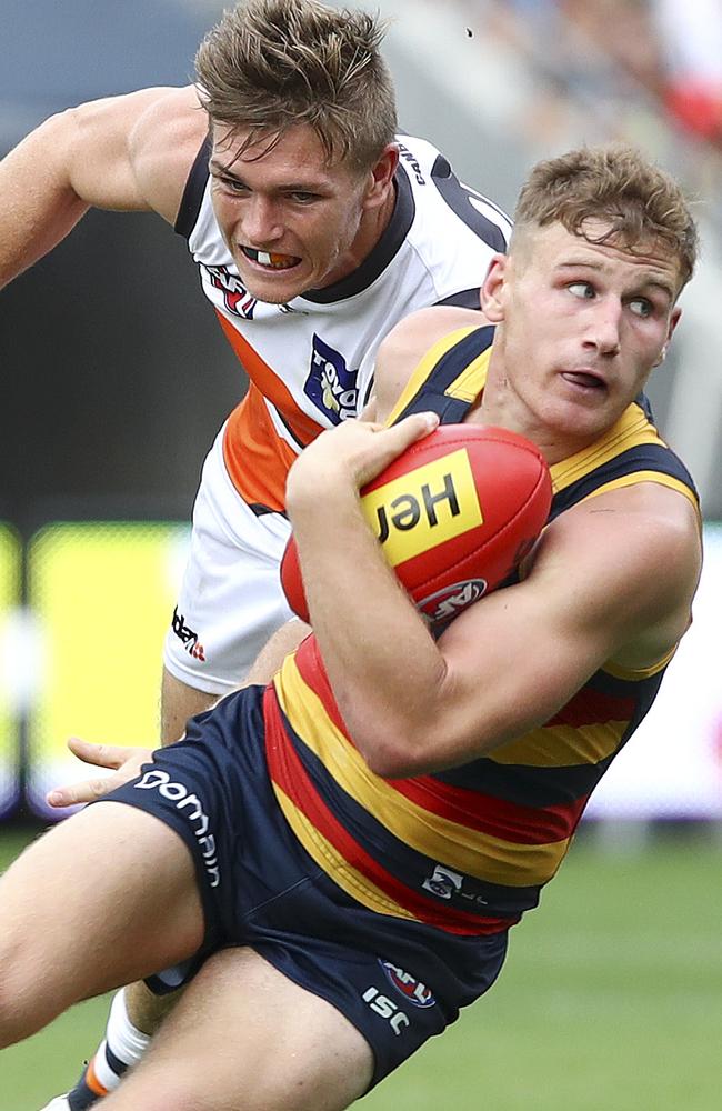 Difference maker ... Rory Laird turns on a dime to escape a Giants tackle. Picture: Sarah Reed