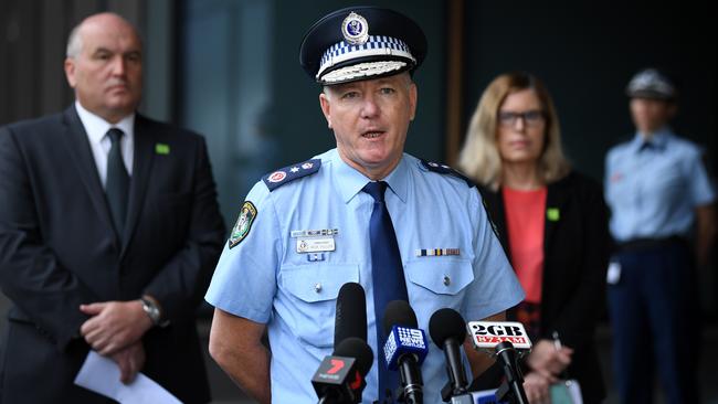 NSW Police Commissioner Mick Fuller faces the media on Monday along with Police Minister David Elliot and the state’s chief medical officer Dr Kerry Chant. Picture: AAP