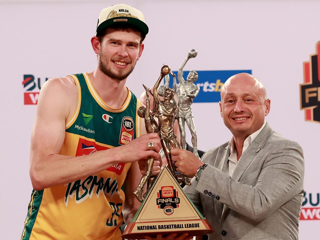 Tasmania captain Clint Steindl and NBL owner Larry Kestelman with the NBL24 championship trophy. Picture: Getty Images