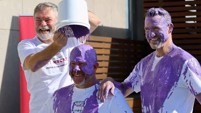 AFL legends take on the Purple Muck Challenge