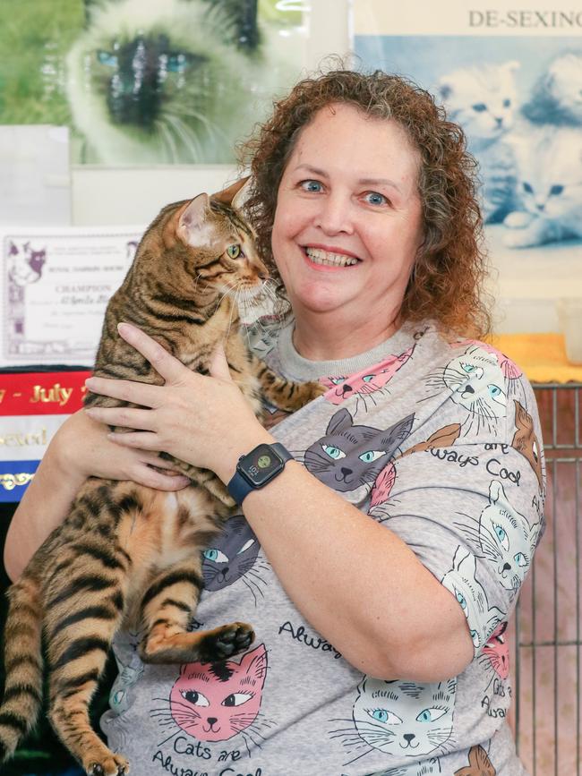 Leanne Gower with her prize winning Toyger cat, El Sprite Blaze, enjoying day two of the Royal Darwin Show. Picture: Glenn Campbell