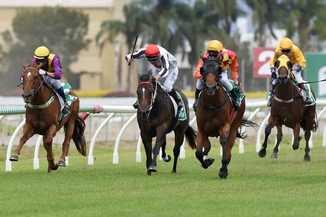 The horses come down the straight of Saturday’s Maiden Handicap (1100m) at the Gold Coast. Picture: Steve Holland.