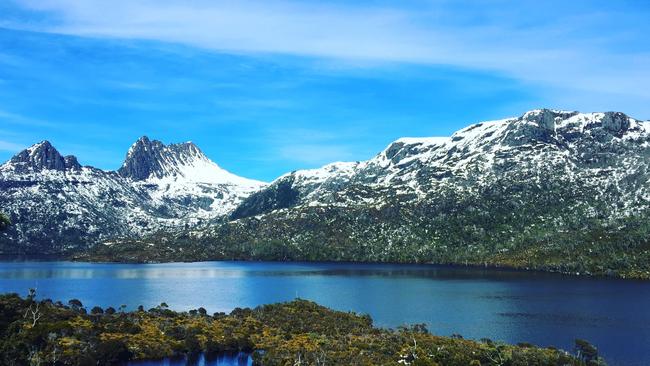 A reader’s picture of Dove Lake, at Cradle Mountain, with snow-capped peaks. Picture: JIE ECCLES