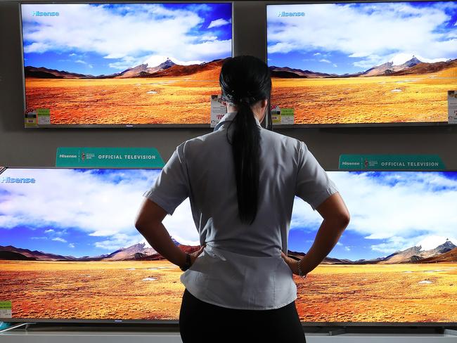 A woman looking at televisions for sale, Harvey Norman, Homemaker Centre, Newstead. Photographer: Liam Kidston.