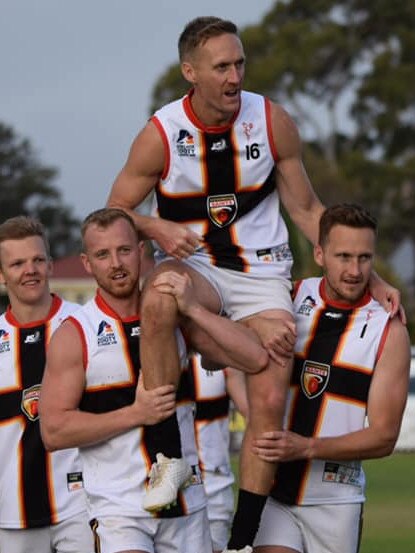 Goodwood's Tom Anderson is chaired off following his 150th game after kicking a crucial goal in the Saints’ win over Brighton. Picture: Mardi Graetz