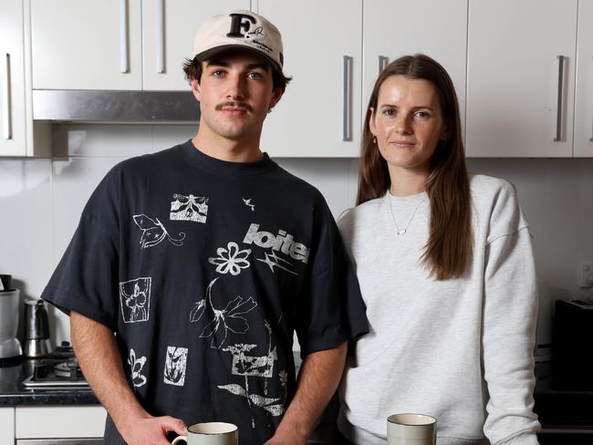 Troy Wilson and Amber Knight at their Neutral Bay home, where they find themselves trying to pinch pennies wherever possible. Picture: Damian Shaw