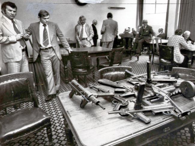 Detectives inside the Victoria Club display weapons similar to those used during the Great Bookie Robbery in the hope of identifying the culprits. Picture: HWT Library