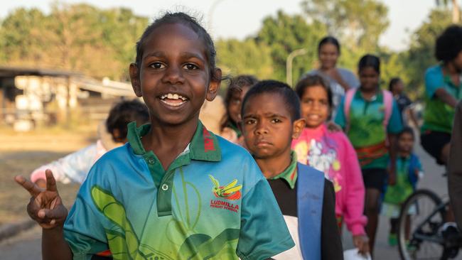 Ludmilla Primary School's attendance and engagement has increased thanks to a partnership with the Bagot Community walking school bus program. Picture: Pema Tamang Pakhrin