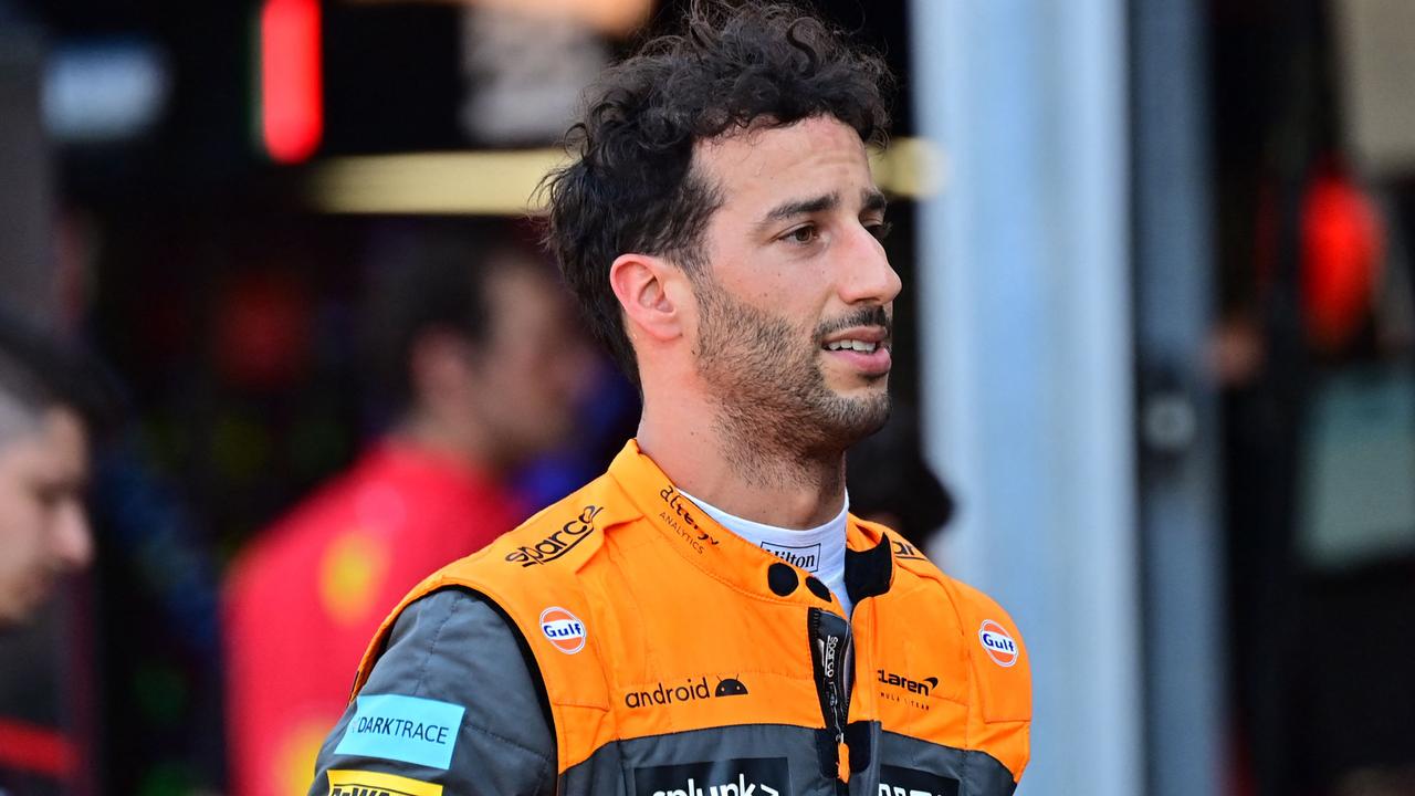 McLaren's Australian driver Daniel Ricciardo returns to the pit lane after a crash during the second practice session at the Monaco street circuit in Monaco, ahead of the Monaco Formula 1 Grand Prix, on May 27, 2022. (Photo by ANDREJ ISAKOVIC / AFP)