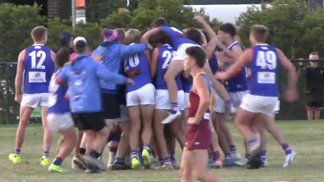 North Heidelberg players celebrate after the final siren.