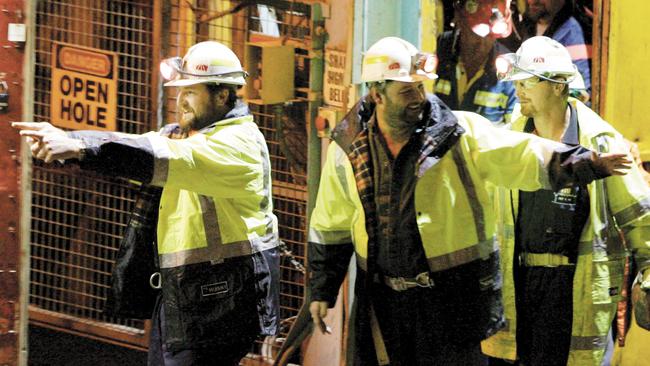 Tasmanian miners Todd Russell (L) and Brant Webb (2-L) wave as they emerge from the mine lift having been rescued after being trapped underground at Beaconsfield gold mine for 14 days May 9, 2006 in Beaconsfield, Australia. The two miners were involved in a mining accident 14 days ago after an earthquake caused a rock fall, but were found alive but trapped by fallen rocks almost one kilometre below the surface. Another miner, Larry Knight was killed in the accident. (Photo by Ian Waldie/Getty Images) *** Local Caption *** Todd Russell;Brant Webb