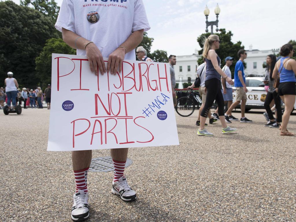 Trump supporters rally in support of his decision to withdraw the US from the Paris Climate Accord outside the White House in June 2017. The concerns about jobs will also be an issue for the Biden administration. Picture: AFP/Saul Loeb