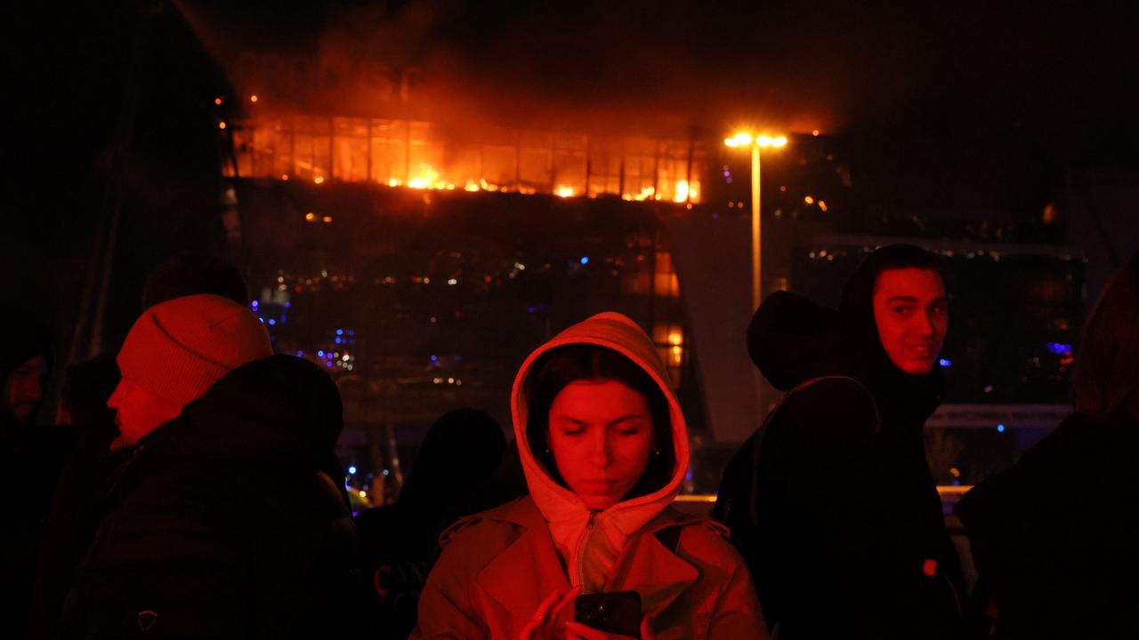 Some of those who managed to escape the deadly attack on the Crocus City Hall. Picture: Stringer/AFP.