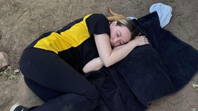 Ms Scott held her puppy for the last time after it a vicious alleged attack. Picture: Supplied.