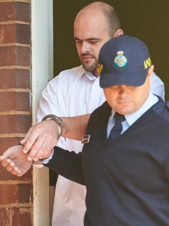 Vincent Stanford is taken from Griffith Court after his sentencing to life in prison. Picture: Michael Frogley