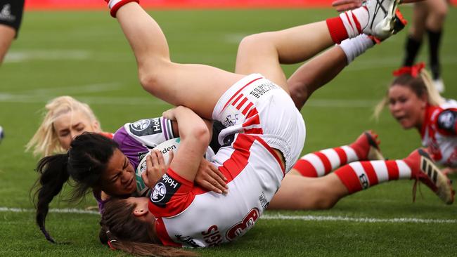 Langi Veainu is tackled and held up over the try line by Dragons star Jessica Sergis. Picture: Getty Images