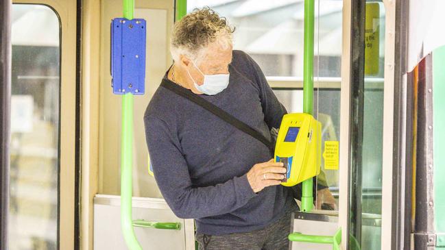 Maskless commuters sometimes outnumber those who are obeying the state’s pandemic orders and covering up. Picture: Wayne Taylor