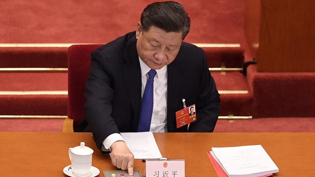 Chinese President Xi Jinping votes during a session of the National People's Congress at the Great Hall of the People in Beijing last week. Photo: AFP.