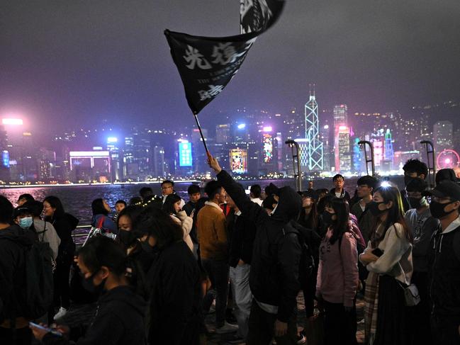 Pro-democracy protesters take part in a march along the promenade of Tsim Sha Tsui district in Hong Kong. Picture: AFP