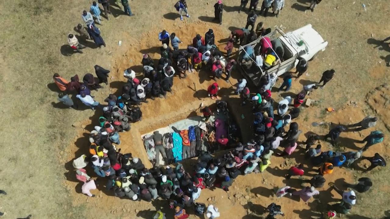 Families burying their relatives in a mass grave in Maiyanga village, in Bokkos local government after deadly attacks conducted by armed groups in Nigeria's Central Plateau State. Picture: Kim Masara / AFPTV / AFP